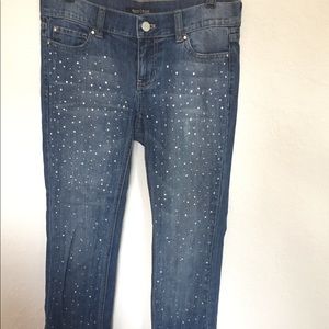 Crop jeans with rhinestones on the front.